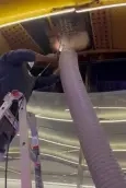 Everett Summit technician performing professional air duct cleaning inside an Everett, WA home