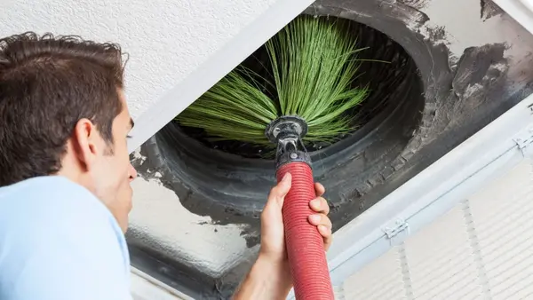 HVAC technician cleaning air ducts professional service Everett WA
