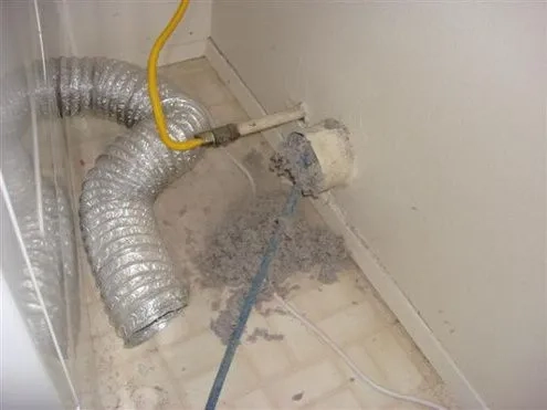 Professional air duct cleaning setup in Everett home with vacuum hose and tools